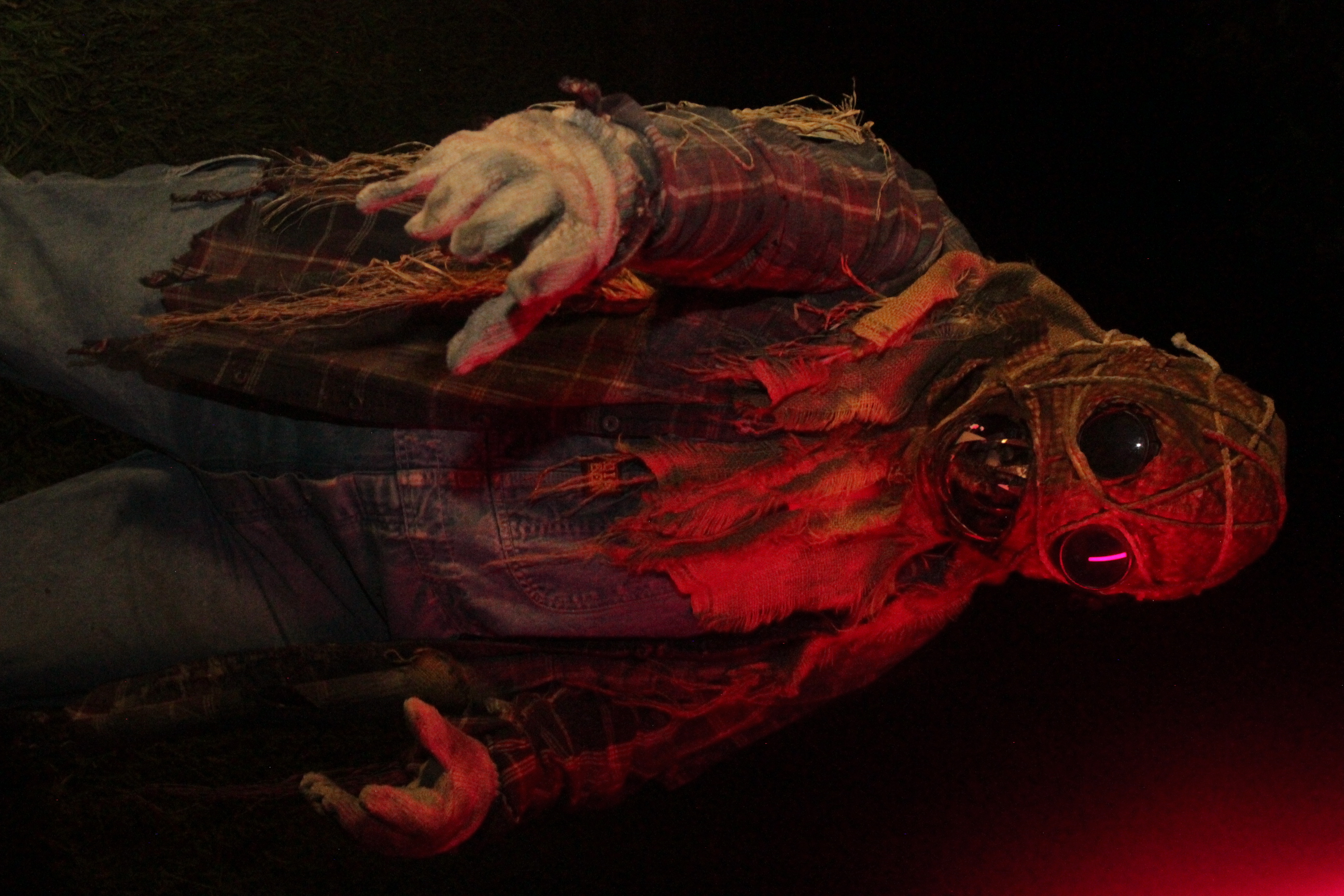 Actor reaching toward the camera under purple lighting